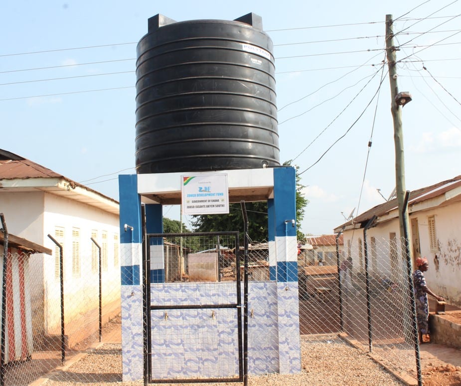 Mechanized borehole fitted with electric pump and overhead water tank at Juaso Zongo